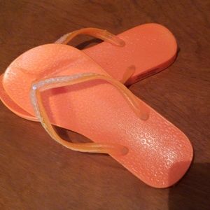 Neon orange sequin flip flops